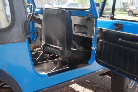 1981 Jeep CJ7 - Interior view of a 1981 Jeep CJ7, highlighting the driver's side seat and door.