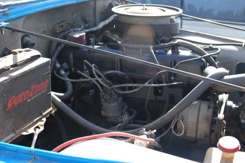 1981 Jeep CJ7 - Close-up view of the engine bay, the air filter and battery.