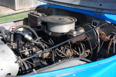 1981 Jeep CJ7 - Engine bay of a 1981 Jeep CJ7, showing the V8 engine and associated components.