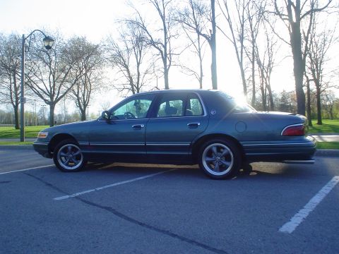 1996 Mercury Grand Marquis - This 1996 Mercury Grand Marquis is seen from the side in a parking lot.