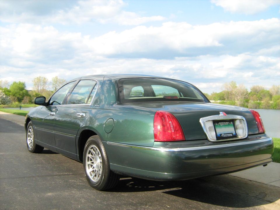 Green sedan rear view
