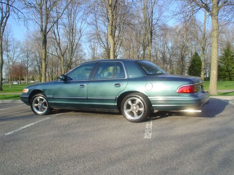 1996 Mercury Grand Marquis - This 1996 Mercury Grand Marquis is seen from the side in a parking lot.