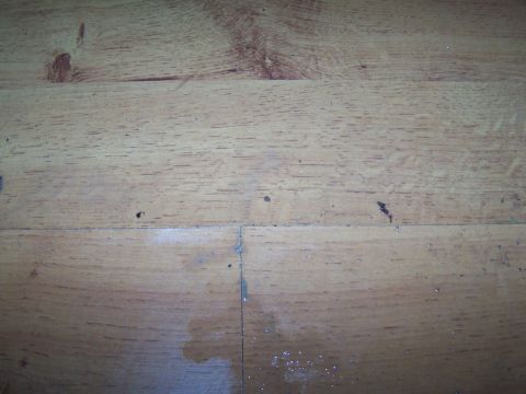 1978 Ford Bronco - The image shows a close-up of a wooden surface with visible grain patterns and some minor imperfections.