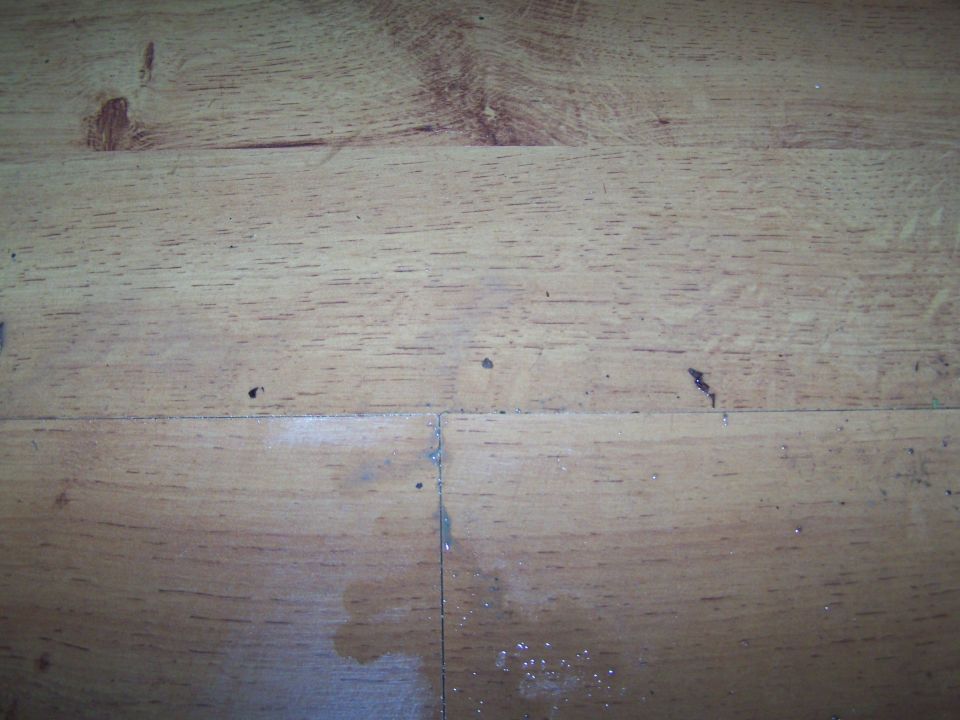 wooden surface with grain and some marks
