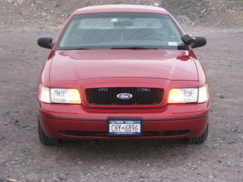2000 Ford Crown Victoria - Red 2000 Ford Crown Victoria police car front view.