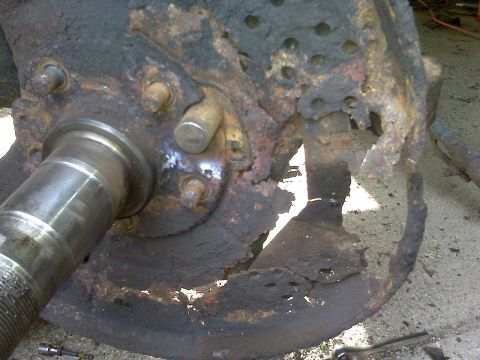 1995 Ford Bronco - This severely corroded brake rotor and hub assembly shows significant wear and damage.