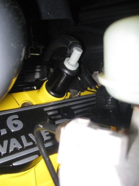 2003 Mercury Marauder - Close-up of an engine component, possibly an oil separator, with visible text on the engine block.