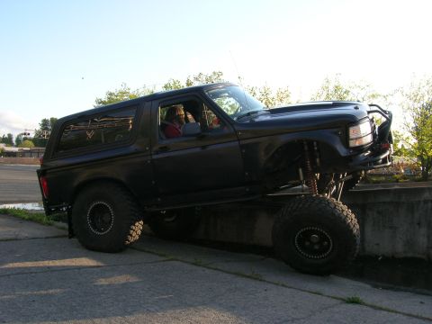 1996 Ford Bronco - This modified 1996 Ford Bronco features an aggressive stance with its lifted suspension and oversized tires, ready for off-road adventures.