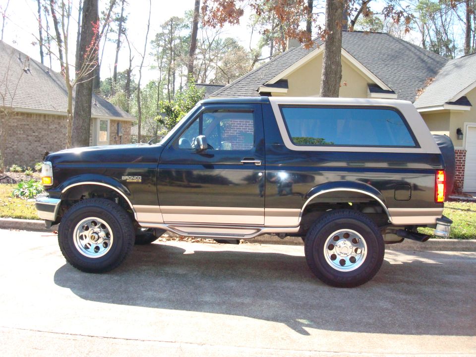 1996 Ford Bronco parked on street, side view