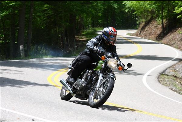 Motorcycle with rider on a winding road