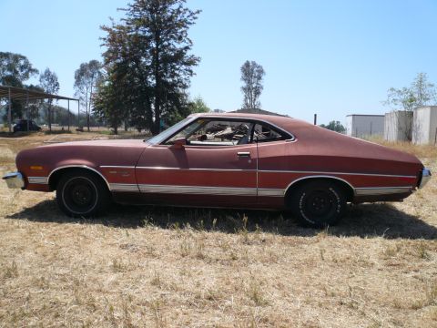 1975 Ford Ranchero - This 1972 Ford Ranchero is seen from the side, parked outdoors on a sunny day.