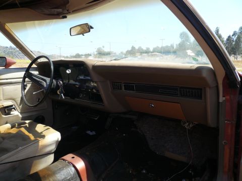 1975 Ford Ranchero - Interior view of a 1975 Ford Ranchero, highlighting the dashboard and driver's seat condition.
