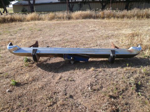 1975 Ford Ranchero - Chrome bumper assembly with trailer hitch, likely for a classic American car or truck.