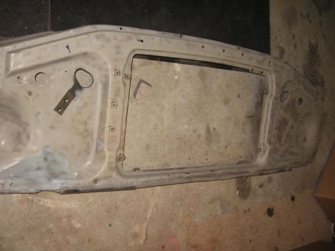1966 Ford F-100 - Inner structure of a truck hood, likely undergoing paint preparation.