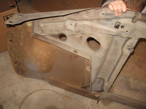 1966 Ford F-100 - Close-up view of a corroded truck fender well, revealing internal structural components.