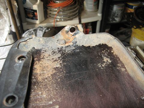 1966 Ford F-100 - This heavily rusted metal part shows significant wear and corrosion.