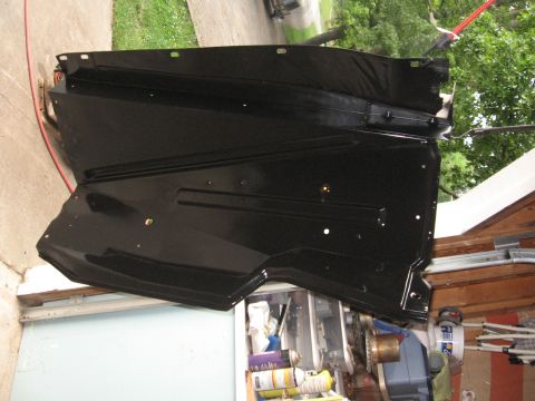 1966 Ford F-100 - A black metal panel, possibly a fender liner or splash guard, is shown hanging outdoors.