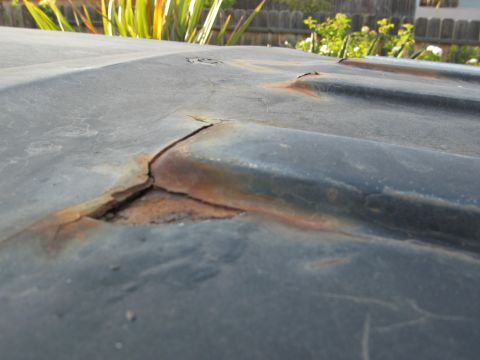 1986 Ford Bronco - This photo shows a damaged roof panel with significant rust and a crack.