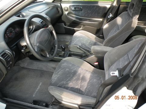 1994 Acura Integra - Interior view of a 1994 Acura Integra, highlighting the seats, steering wheel, and dashboard details.