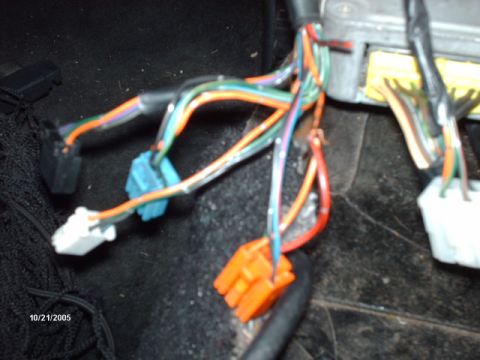 1995 Ford Probe - A close-up view of a vehicle's interior wiring harness and connectors.