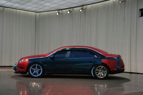 1993 Ford Taurus - This sedan features a unique tri-color paint scheme with contrasting front and rear panels.