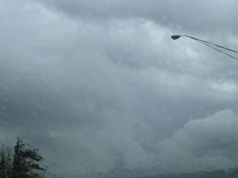 1995 Ford C-350 (Centurion Conversions) - A street lamp is visible against a backdrop of dark, stormy clouds.