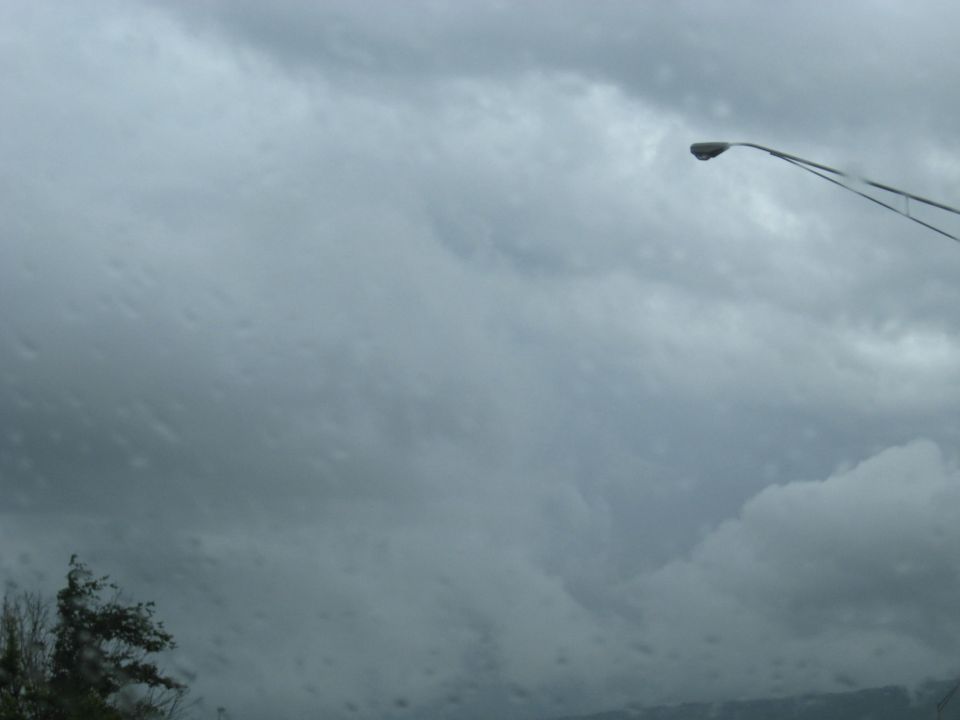 Stormy sky with a street lamp on the right
