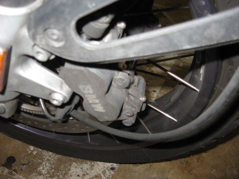 2004 BMW R1150GS ABS Adventure - Left side brake caliper showing retainer/anti-rattle clip.