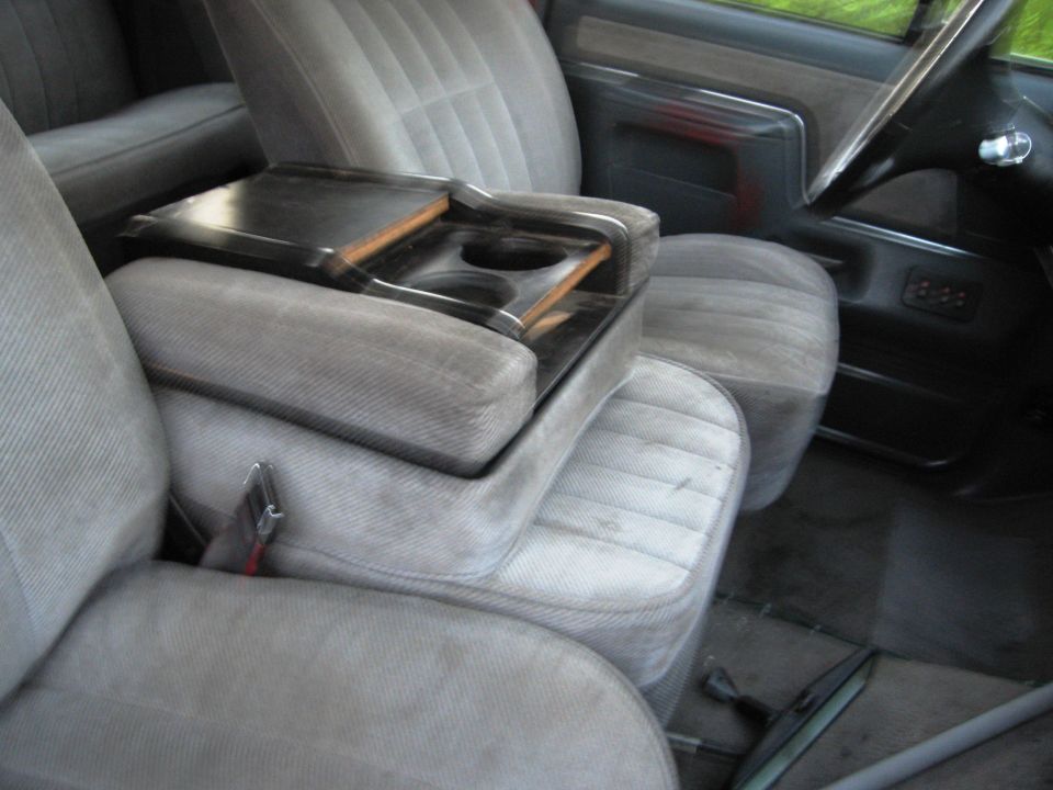 Gray cloth interior seats and center console with cup holders. 1986 Ford Bronco