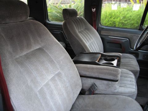 1986 Ford Bronco - Interior view of the front seats and center console in a 1986 Ford Bronco.