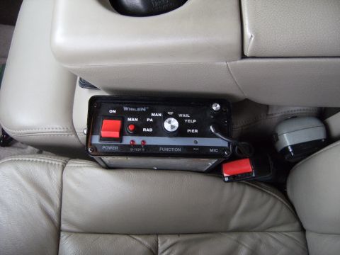 2005 Ford F-150 - Interior view of an emergency equipment control box installed in a vehicle's cabin.