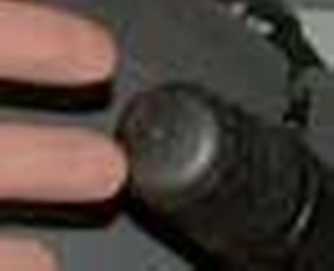 1971 Ford Ranchero - A finger interacts with a control knob within a dimly lit vehicle cabin.