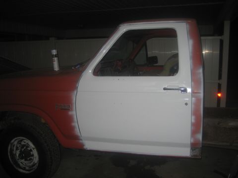 1983 Ford F-250 - This 1983 Ford F-250 is undergoing body work, with primer and paint visible on different panels.