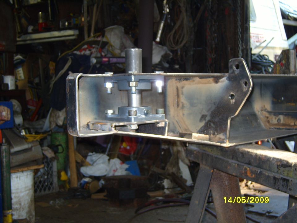 Rear bumper bracket with a metal post assembly