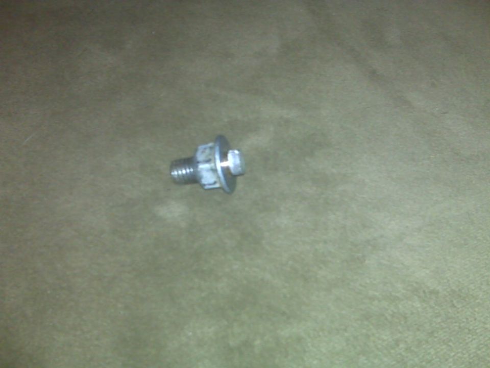 Bolt with a washer and nut on a textured surface