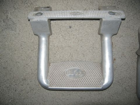 1986 Ford Bronco - Pair of silver step bars with a textured surface and the 'BULLY' logo embossed on the tread.