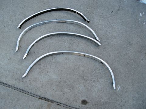 1986 Ford Bronco - Set of four curved metal fender trim pieces for sale.