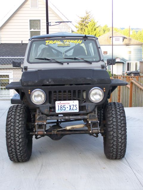 1988 Suzuki Samurai - This heavily modified SUV features oversized tires and a lifted suspension, ready for off-road adventures.