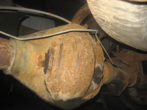 1983 Ford F-250 - Rusty rear differential and axle assembly, likely from an older truck or SUV.