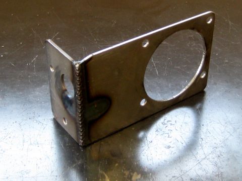 1996 Ford Bronco - This metal bracket features a large circular cutout and several smaller holes for mounting.