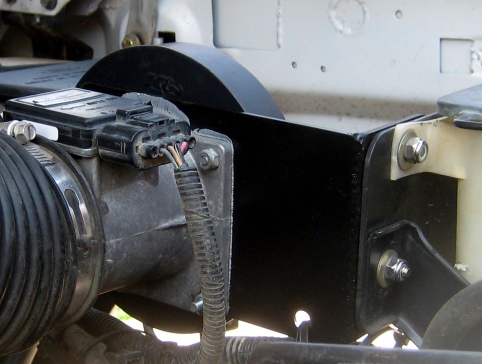 Engine air intake assembly with mass airflow sensor and black heat shield