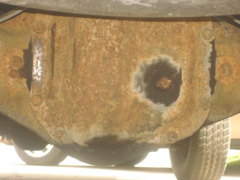 1983 Ford F-250 - The rear axle differential shows significant rust and wear.