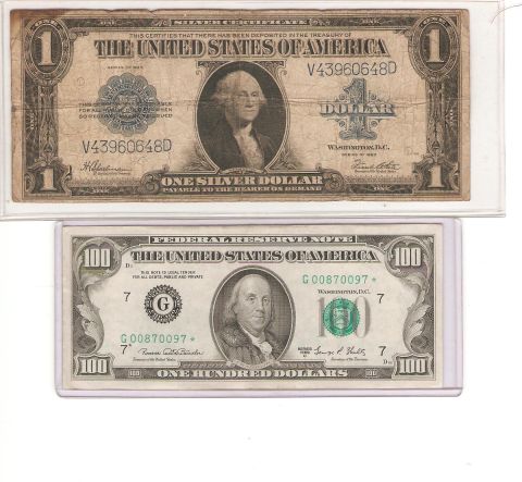 1995 Ford Bronco - Two bills of United States currency, a one dollar bill and a one hundred dollar bill, are displayed side-by-side.