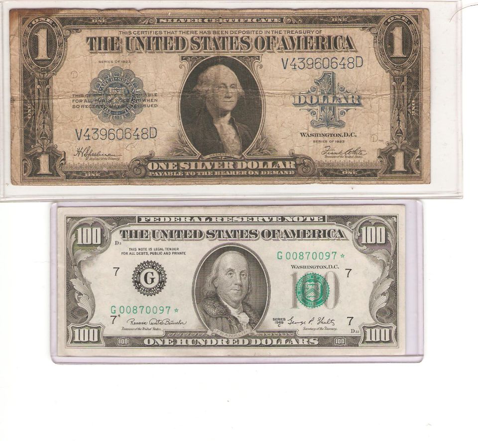 Two United States currency bills, a one dollar and a one hundred dollar bill, in protective sleeves