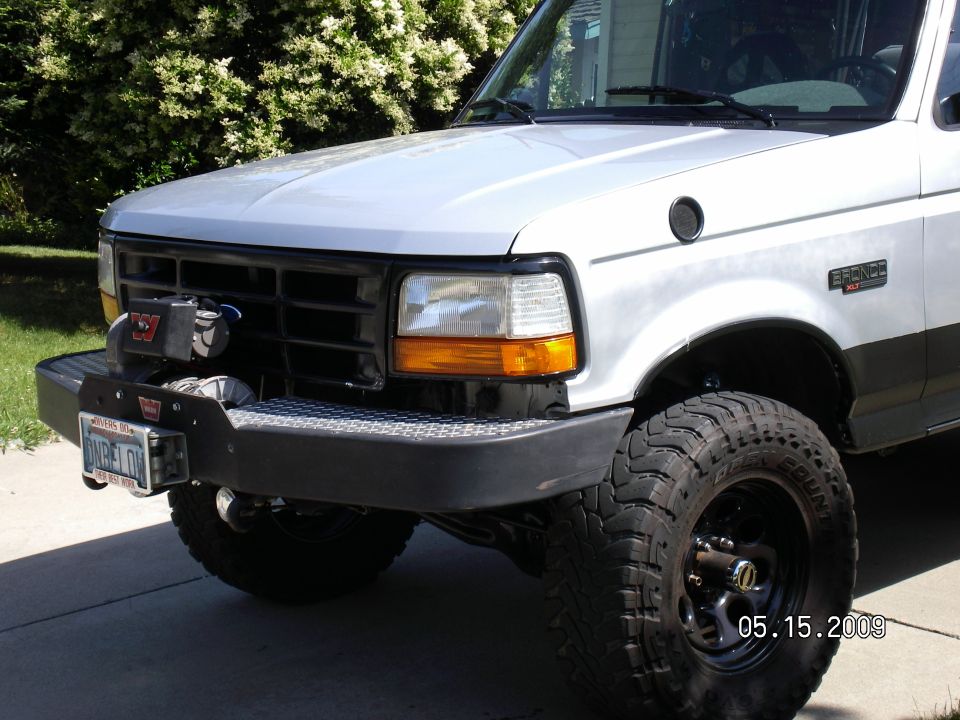 The bumper follows the body lines and has great ground clearence and approach angles. I painted the stone deflector piece black, like the cowl, to blend into the front, but have to take everything off to install it!
