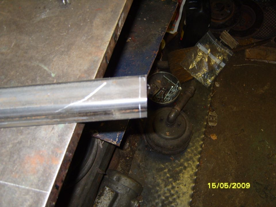 Metal bar with scribe lines on a workbench