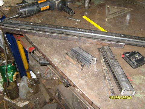 1989 Ford Bronco - Metal parts and tools are laid out on a workbench, with a date stamp indicating May 15, 2009.