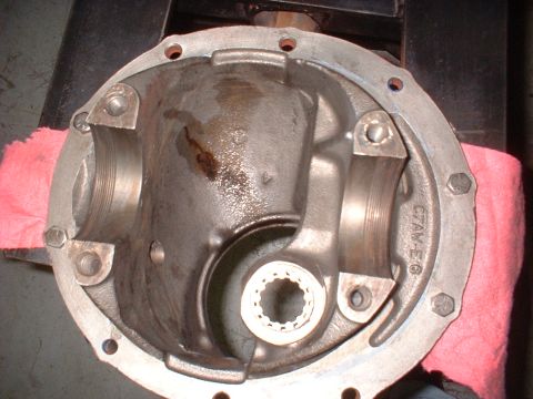 1970 Ford Torino - Differential housing part with visible bearing surfaces and a splined yoke, resting on a pink cloth.