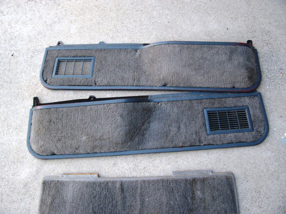 Gray carpeted interior door panels with air vents