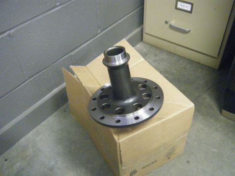 1978 Ford Bronco - A differential gear part rests on a cardboard box in front of a filing cabinet.